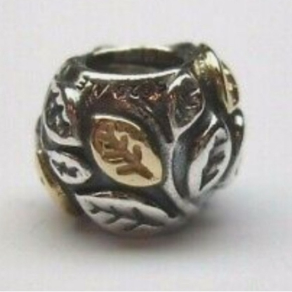 Pandora tree of life charm. 
Sterling silver and 14 K